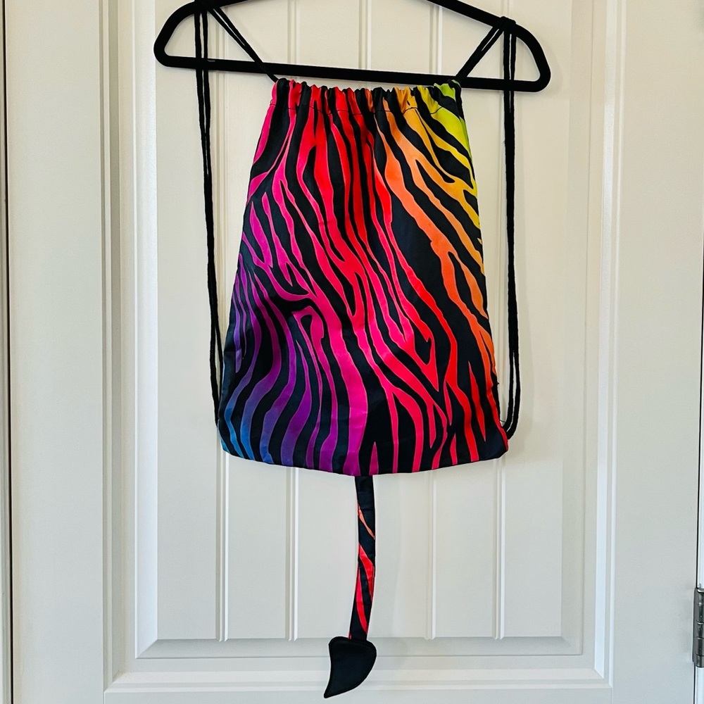 Spirit Halloween Drawstring Rainbow & Tiger Stripe Backpack with Dragon Tale